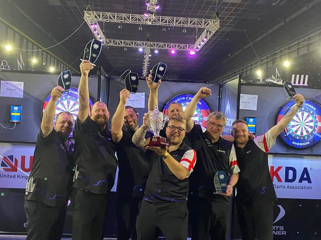 A group of people holding up trophies

Description automatically generated